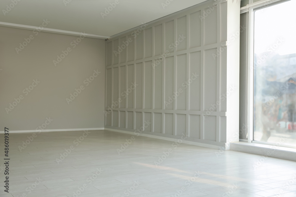 Empty room with panoramic windows and white wooden floor Empty room with panoramic windows and white wooden floor