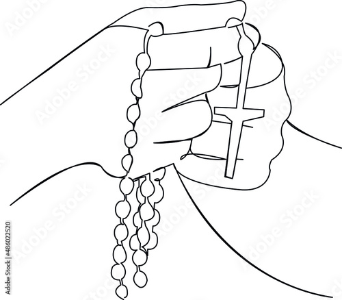 hands with catholic rosary