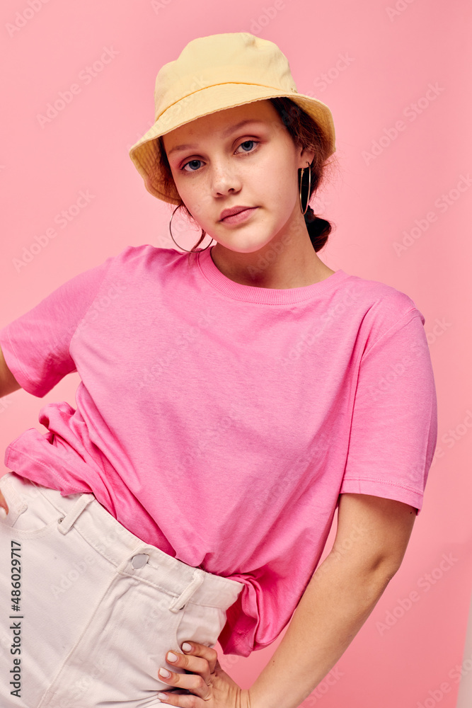 portrait of a young woman fashion clothes hat pink t-shirt decoration posing portrait of a young woman fashion clothes hat pink t-shirt decoration posing