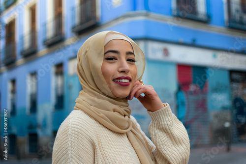 Portrait of young muslim woman wearing hijab looking at camera

 photo