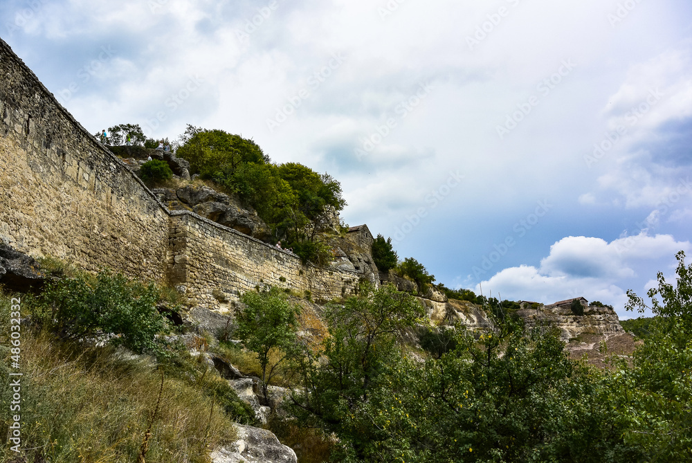 Buildings, buildings and caves of the city of Chufut-Kale, a medieval cave settlement in the Crimea. Cave city.