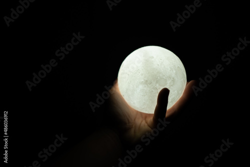 Moon in hands,The stars that are followers of the world on hand,save of moon,environment concept for background web.