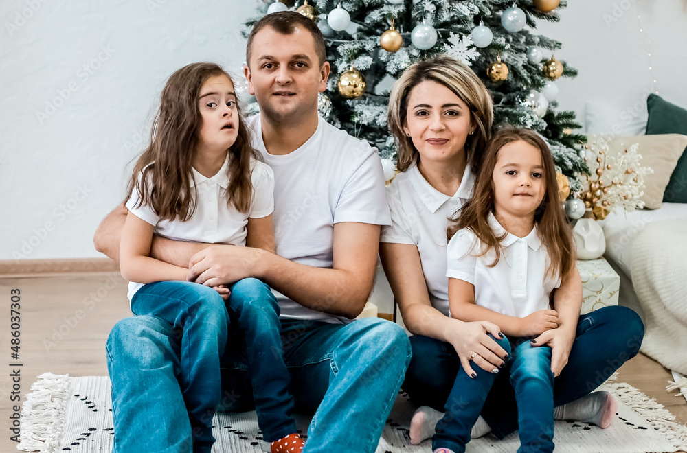 Happy family and New Year's fairy tale. Girl with down syndrome Happy family and New Year's fairy tale. Girl with down syndrome