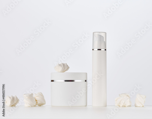 white round plastic jar and bottle  for cosmetic products. Blank for branding products  mock up