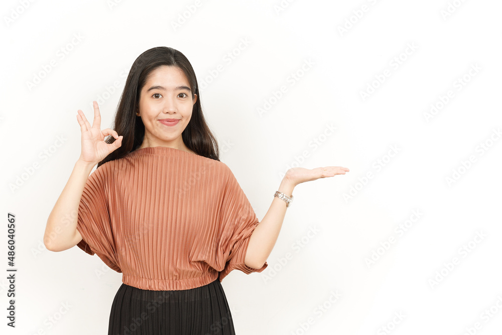 Showing and Presenting Product on Open Palm Of Beautiful Asian Woman Isolated On White Background Showing and Presenting Product on Open Palm Of Beautiful Asian Woman Isolated On White Background