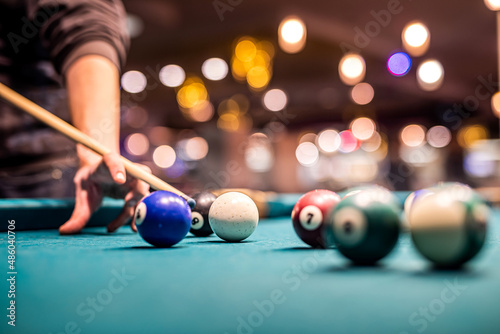 Obraz na plátně a group of young people came to play billiards and in the young hands was a cane and layers
