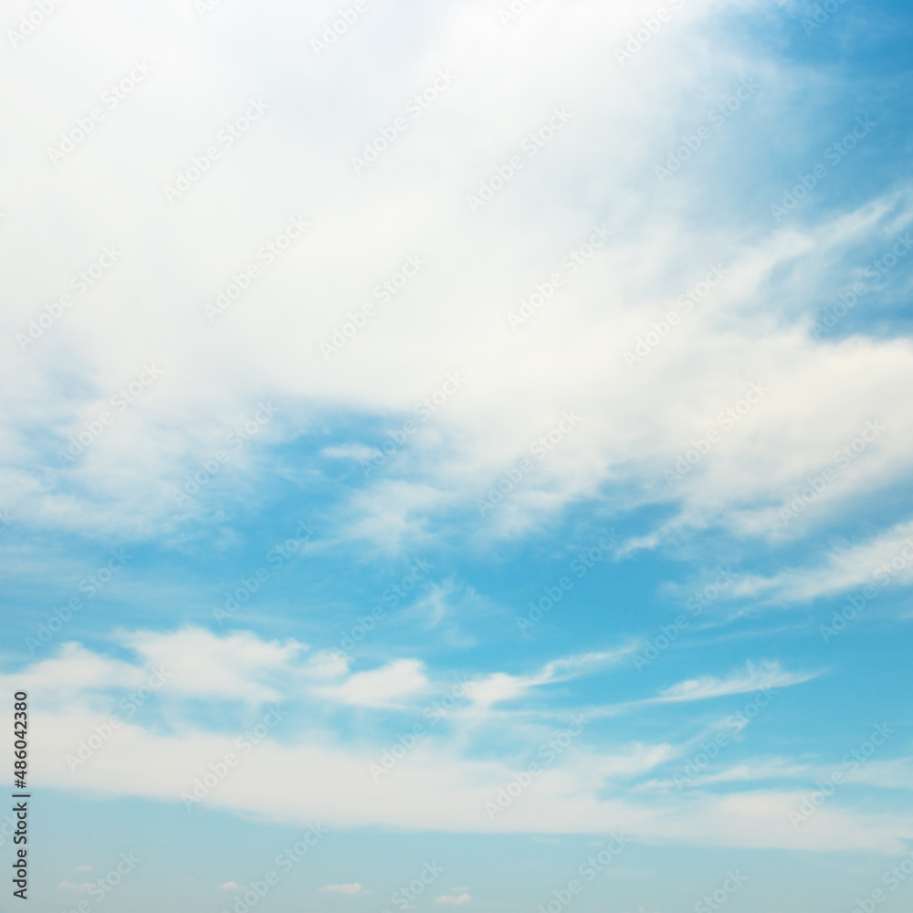 White fluffy clouds on blue sky