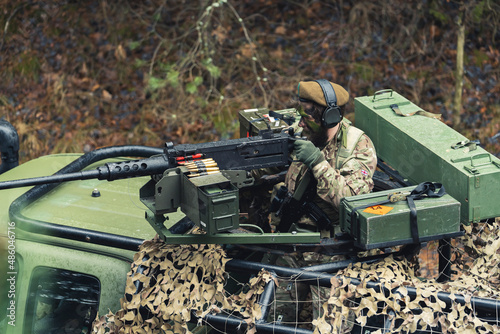 Obraz na plátne Aiming to fire attack from a protected patrol vehicle of British military