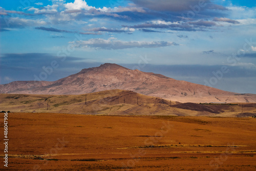 amazing mountain peak kazygurt under blue sky  photo