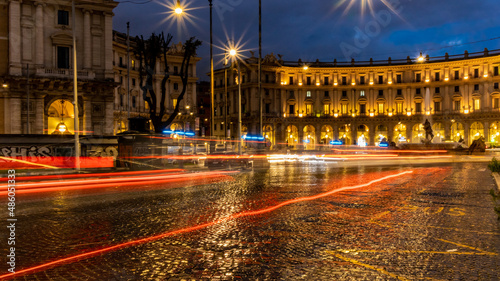 Cars light trails in the evening square in Rome right after the rain. Night traffic routes. Motion blur. Cityscape. © Prodocdrone