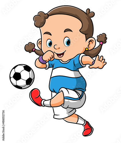 The little girl is playing the soccer and kicking the ball