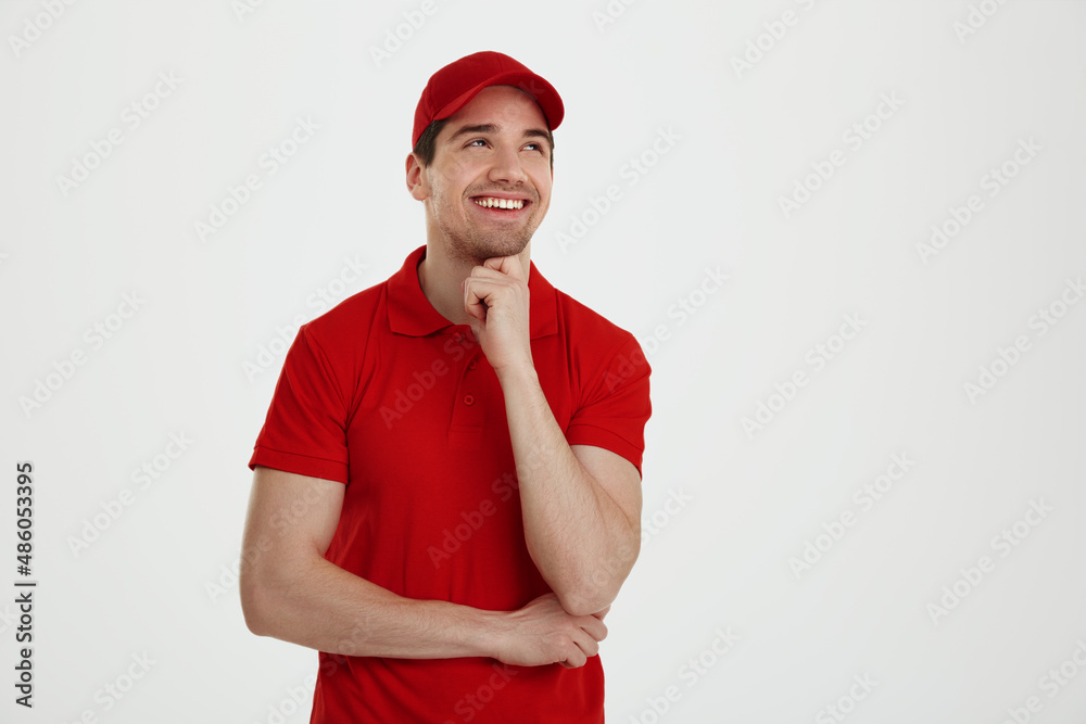 Young male courier on white background in studio Young male courier on white background in studio