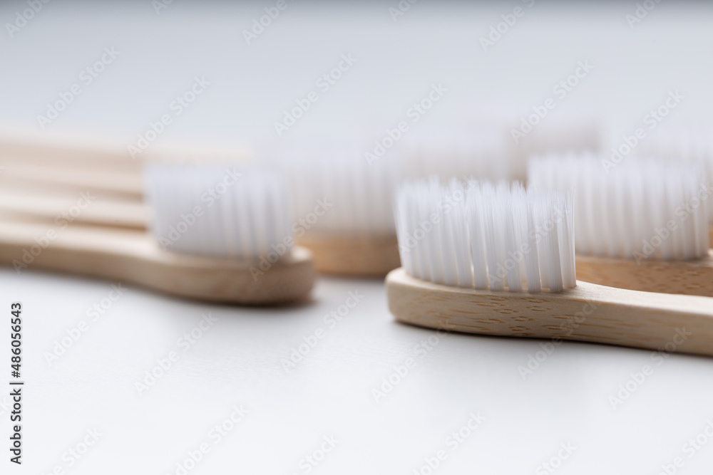 Set of ECO friendly wooden bamboo toothbrushes. Save the planet or NO plastic concept. Isolated on white background. Set of ECO friendly wooden bamboo toothbrushes. Save the planet or NO plastic concept. Isolated on white background.