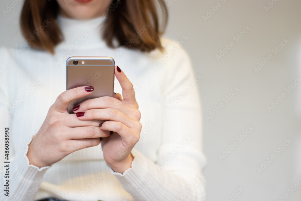 Smartphone image of a woman's hand holding mobile phone Smartphone image of a woman's hand holding mobile phone