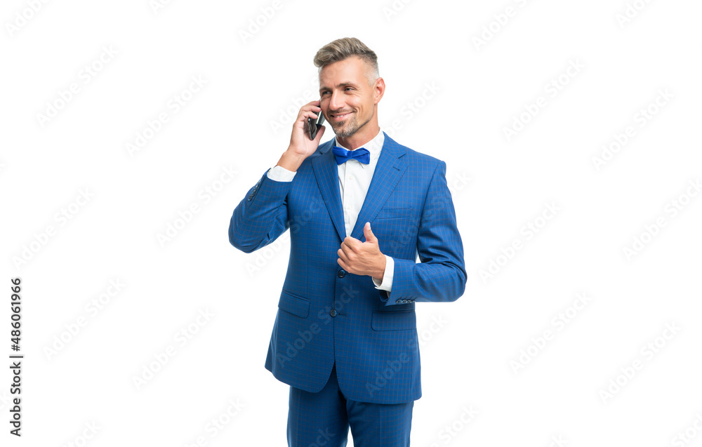 cheerful man in blue bow tie suit talk on phone isolated on white cheerful man in blue bow tie suit talk on phone isolated on white