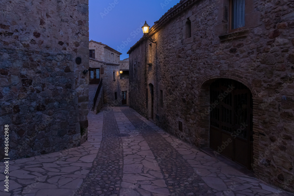 stone street in the medieval village of pals at night