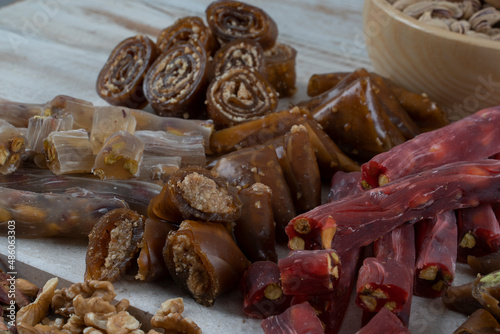 Variety of Turkish natural dried fruit pulp with walnut ,peanut ..sausage. Kind of sweet food of Turkish cuisine. Ingredients around such as pomegranate,walnut,peanut..