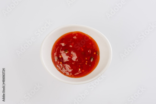 tomato sauce in a white bowl on a white background
