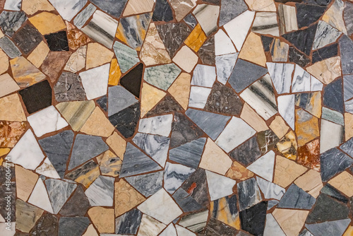 uniquely decorated mosaic of colorful tiles on the floor of a church in Rome, Italy. photo and texture of marble and ceramic tiles