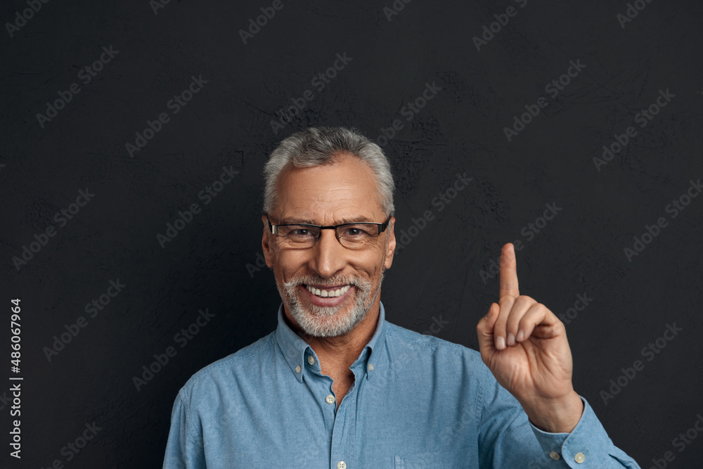 Portrait of smiling senior man having new idea Portrait of smiling senior man having new idea