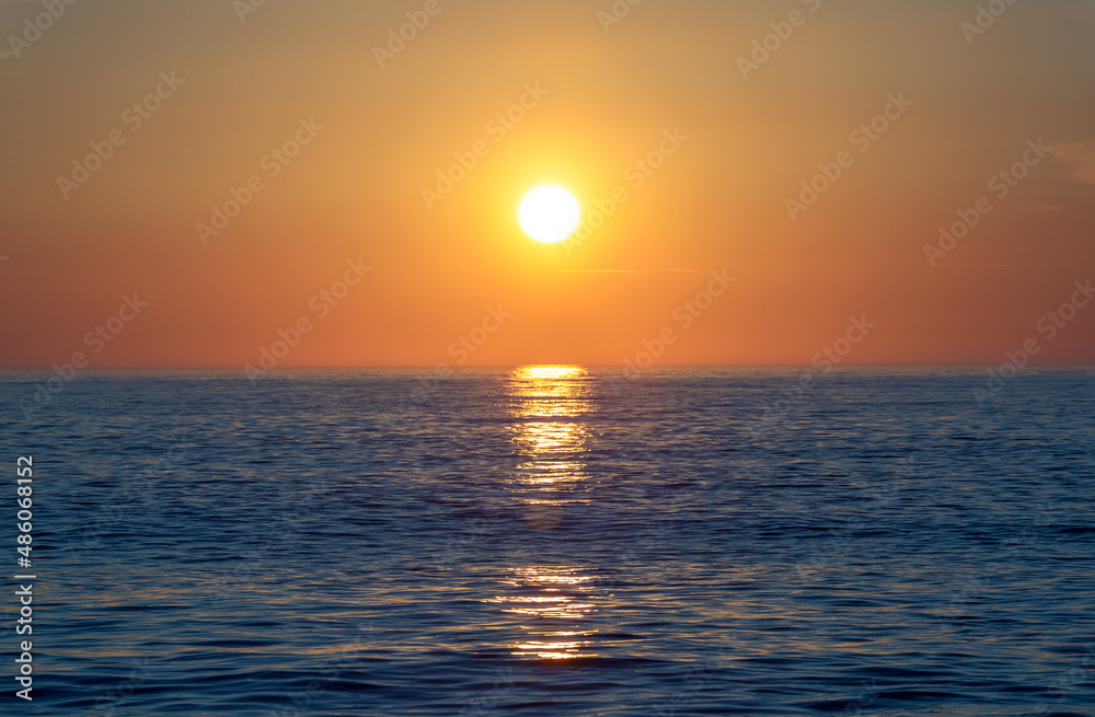 Sunrise at the sea. Beautiful summer view seascape. Amazing sunrise. Morning landscape. Waves with foam. Romantic relax places.