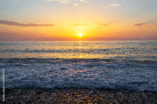 Sunrise at the sea. Beautiful summer view seascape. Amazing sunrise. Morning landscape. Waves with foam. Romantic relax places.