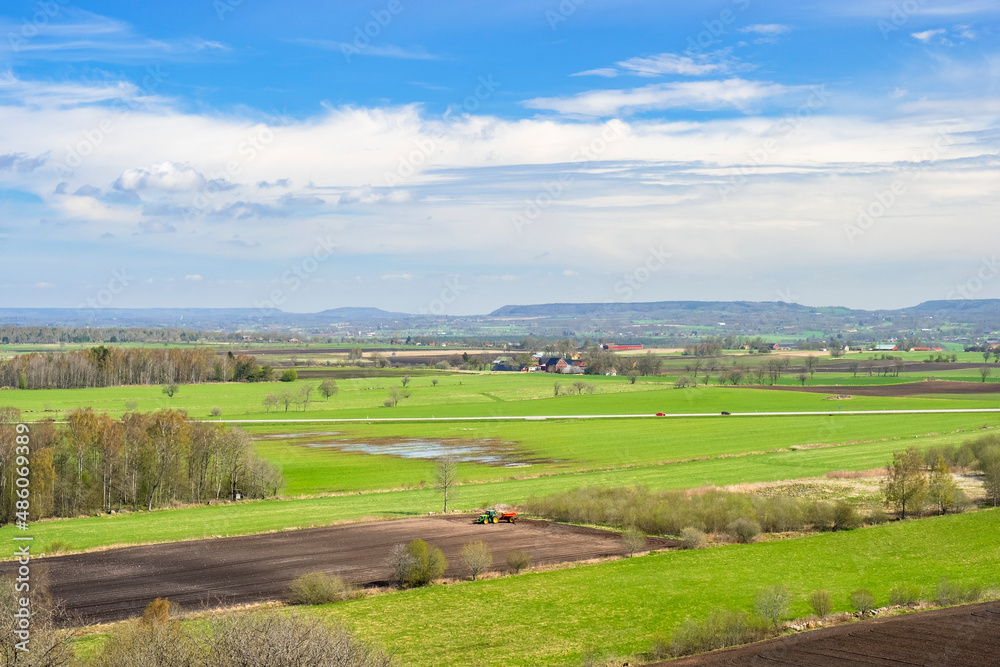 Beautiful landscape view of lush fields in a rural landscape in spring