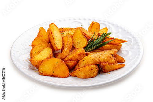 Sliced fried potatoes, Creole-style with spices. On a white plate.