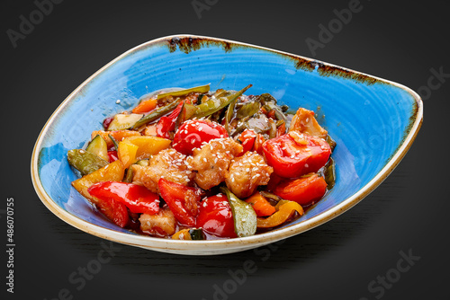 Asian-style chicken with sweet and sour sauce and vegetables.
