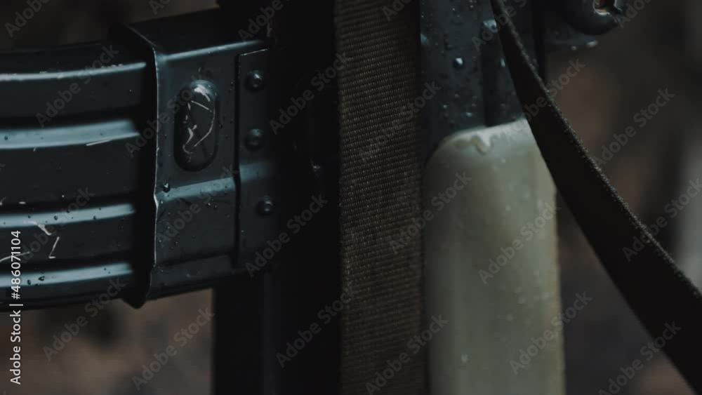 M16 automatic rifle magazine close up shot - panning slow motion. High quality 4k footage M16 automatic rifle magazine close up shot - panning slow motion. High quality 4k footage