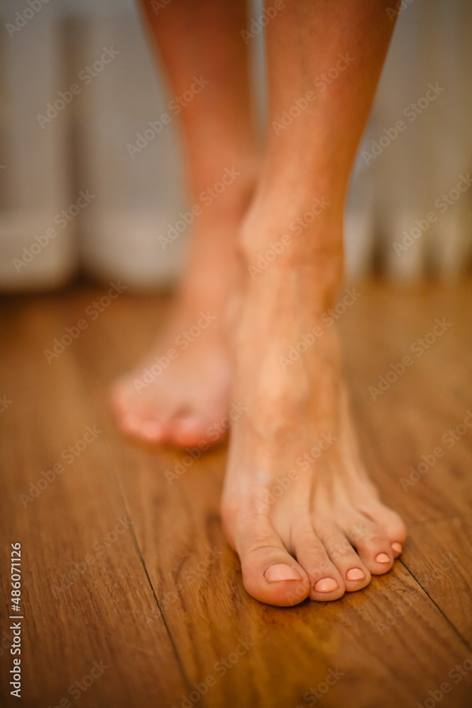 girl's feet on the floor close-up girl's feet on the floor close-up