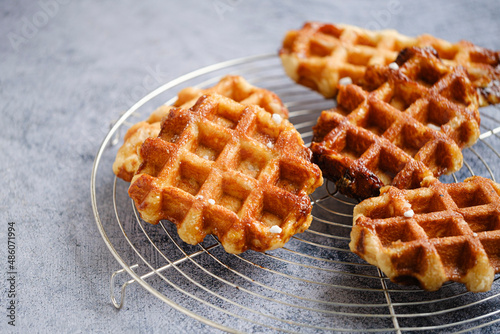 Homemade Belgian Waffles from the city of Liege on round steel trivet