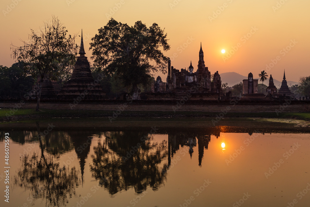 Sukhothai historical park, Wat Mahathat ruins at sunset. One of most beautiful and worth seen place in Thailand. Popular travel destination while visiting southeast Asia.