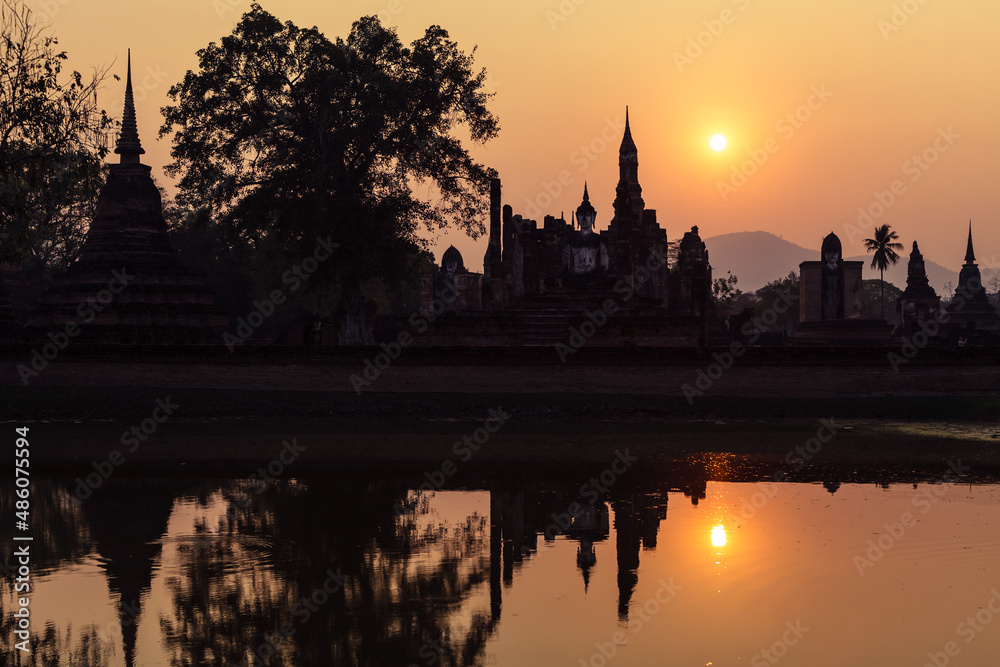 Sukhothai historical park, Wat Mahathat ruins at sunset. One of most beautiful and worth seen place in Thailand. Popular travel destination while visiting southeast Asia.