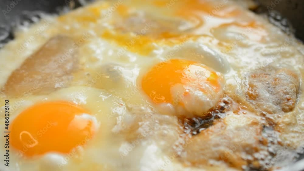 Scrambled eggs and bacon pan fried hd stock footage Scrambled eggs and bacon pan fried hd stock footage