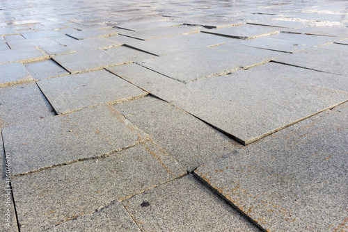 The pedestrian road paved with paving slabs was badly damaged.