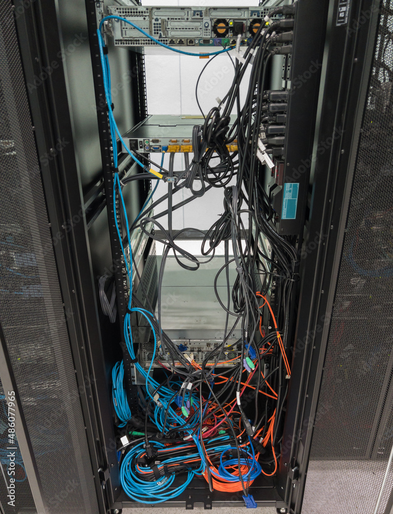 The backside of the server rack after removing the old storage. Stock Photo  | Adobe Stock