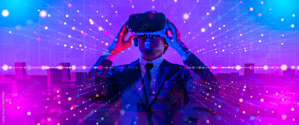 Digital community,Cryptocurrency and entertainment metaverse concept.male having fun play game VR virtual reality goggle in 3D cyberspace futuristic metaverse NFT and virtual reality city background - obrazy, fototapety, plakaty 