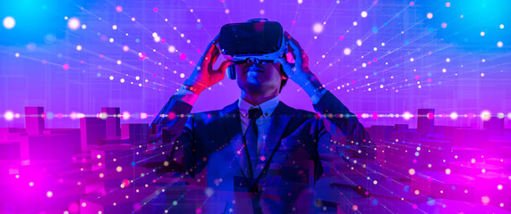 Digital community,Cryptocurrency and entertainment metaverse concept.male having fun play game VR virtual reality goggle in 3D cyberspace futuristic metaverse NFT and virtual reality city background
