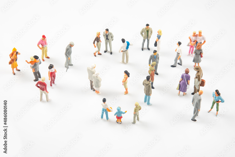 miniature people. different people communicate with each other on a white background