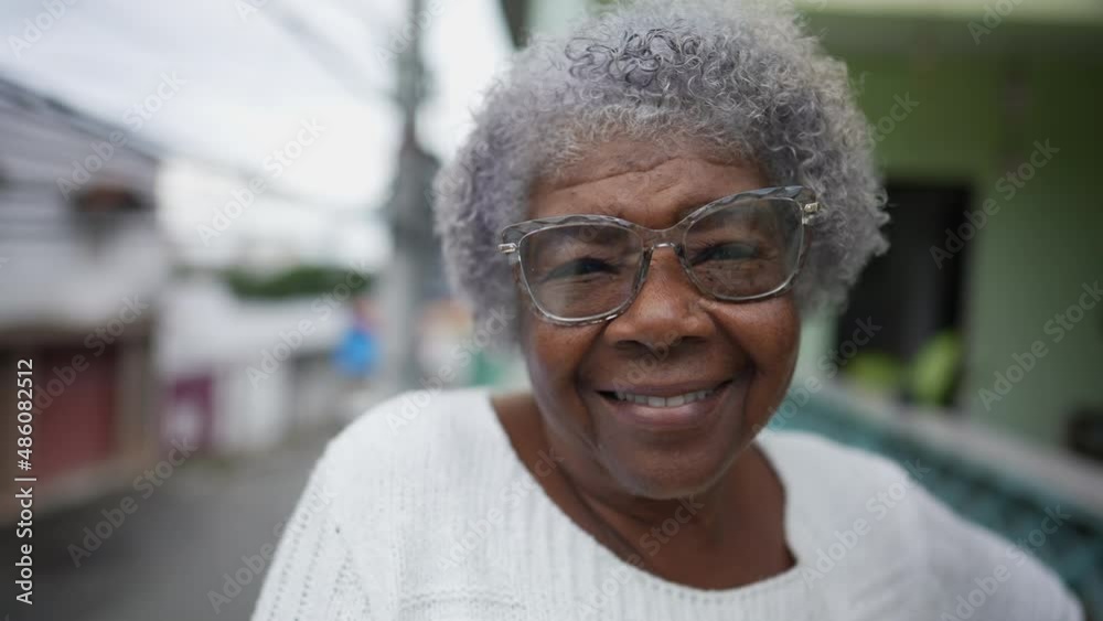 An African Senior woman in 70s smiling portrait one person