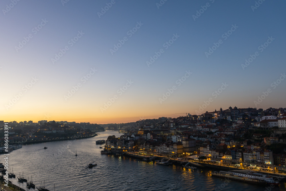 Sunset on the Douro river and the city of Porto illuminated.