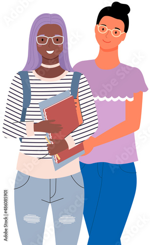 Happy school pupils or college students standing with books. Portrait of smiling happy people. Diverse college, university students, schoolgirl and schoolboy with notebook and gadgets for studying
