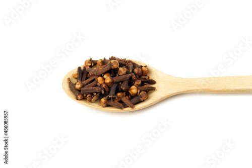 Wallpaper Mural Cloves on wooden spoon isolated on white background. Herbal cloves have a fragrant and spicy flavor. Torontodigital.ca
