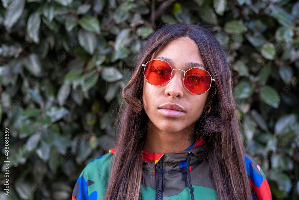 UK, South Yorkshire, Portrait of young woman wearing red sunglasses UK, South Yorkshire, Portrait of young woman wearing red sunglasses