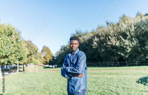 portrait of young african american man enjoying the afternoon in a park on a sunny day