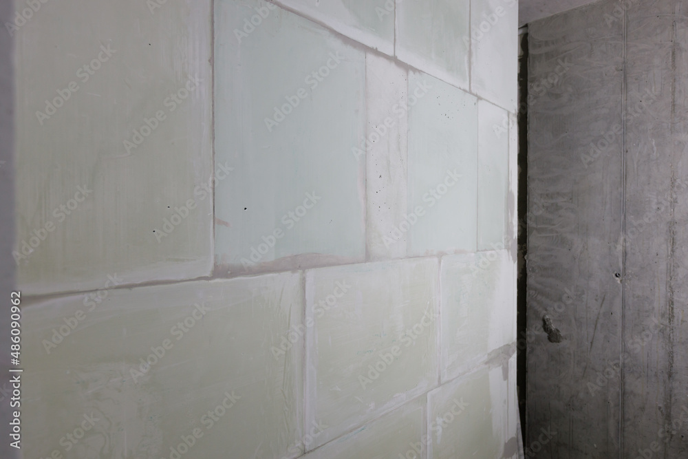 wall made of white gypsum partition blocks, an interior partition.
