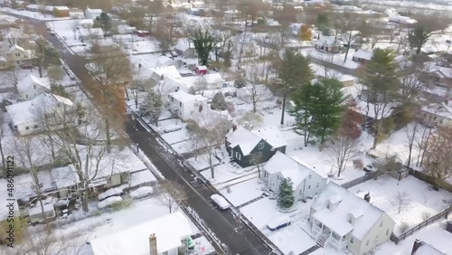 aerial with movement of small Kentucky town on a snowy day at sunrise