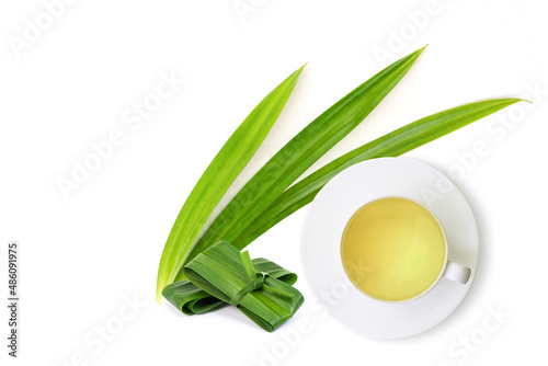 Fresh green pandan leaf and cup of pandan juice tea isolated on white background. 