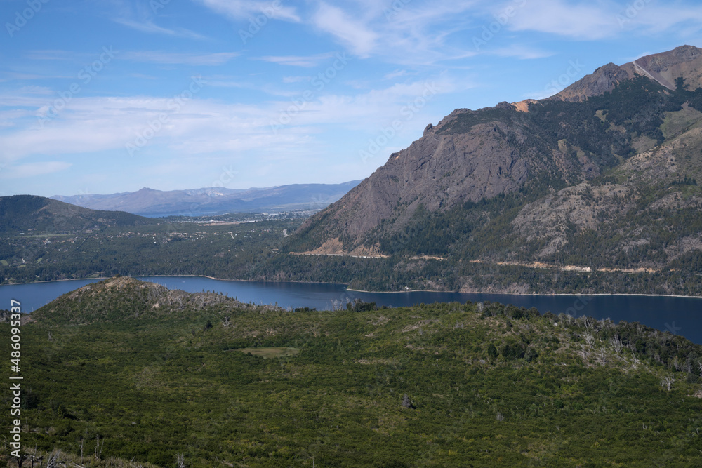 View of the forest, valley and hills surrounding lake Gutierrez in Bariloche, Patagonia Argentina.
